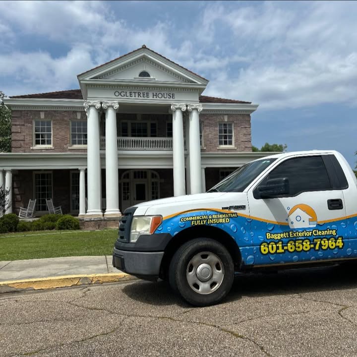 Baggett Exterior Cleaning truck parked in front of a columned building